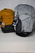 An Evoc Explorer Pro 30ltr backpack in grey and an Evoc Ride 8ltr backpack in loam/carbon grey, both