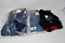 Two pairs of children's as new Tommy Hilfiger jeans (8) and a Tommy Hilfiger dress set (12 months).