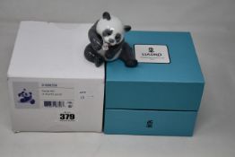 A boxed as new Lladro cheerful panda figurine (01008358).