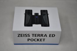A pair of boxed as new Zeiss Terra ED 8 x 25 Pocket Binoculars in black.