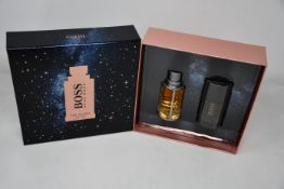 Three boxed as new Hugo Boss The Scent gift sets (Eau de toilette 50ml and deodorant stick 75ml).