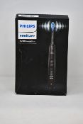 A boxed as new Philips Sonicare 9000 DiamondClean Electric Toothbrush in black.