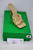 A pair of pre-owned Bottega Veneta Stretch Intreccio raffia sandals in macadamia complete with