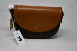 An as new Michael Kors Jet Set Charm half dome bag.