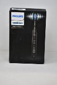 A boxed as new Philips Sonicare 9000 DiamondClean Electric Toothbrush in black.