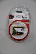 Three as new G7th Performance 3 Guitar Capos for steel strings (Special Edition Celtic Engraved).