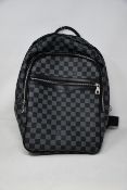 A pre-owned Louis Vuitton Michael backpack in grey/black (Excellent condition).
