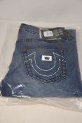 A pair of as new True Religion Rocco jeans (Size 32).
