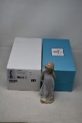 A boxed as new Lladro friend of the butterflies figurine (01006963).