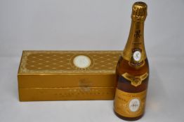 A bottle of Marque Depose Louis Roederer 1995 Champagne in presentation box (Over 18s only).