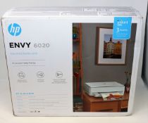 A boxed as new HP Envy 6020 All in One Wireless Printer (P/N: 5SE16B) (Box open, some damage to