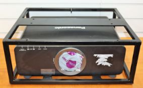 A pre-owned Panasonic PT-DZ680EK DLP Projector (No lens, possible other missing parts/faults. Sold