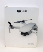 A boxed as new DJI Mini 2 4K Ultra-Light Drone (Model: GL MT2PD RC231) (Box sealed, damage to box).