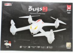 A boxed as new MJX Bugs 2 Brushless Quadcopter Drone (UK plug adapter required) (Box sealed).