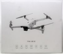 A boxed as new Xiaomi FIMI X8 SE Quadcopter Drone (M/N: FMWRJ02A5) (Box sealed. UK plug adaptor