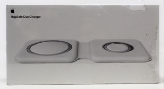 A boxed as new Apple MagSafe Duo Charger (M/N: A2458) (Box sealed, some damage to packaging).