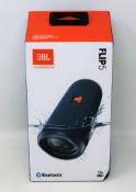 A boxed as new JBL Flip 5 Waterproof Portable Bluetooth Speaker in Blue (Box sealed, ssome damage to