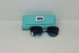 A pair of lady's boxed as new Tiffany & Co. sunglasses (0TF3070 60019S 62).