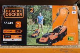 A boxed Black + Decker cordless lawnmower (BCMW3318L2-QW).