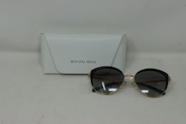 A pair of as new Michael Kors Key Biscayne MK1046 sunglasses.