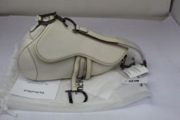 A pre-owned Christian Dior leather saddle bag (Very good condition).