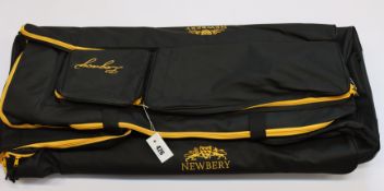 An as new large Newbery Legacy wheeled cricket bag in black with yellow trim.