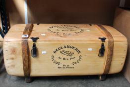 A decorative wooden trunk / chest with 'Boulangerie au bon pain' design.