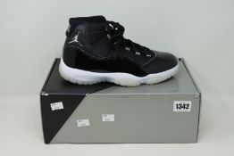 A pair of as new Nike Air Jordan 11 Retro (UK 7).