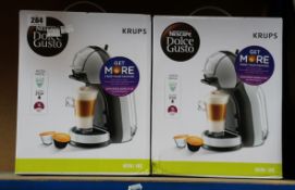 Four boxed as new Nescafe Dolce Gusto mini me coffee capsule machines.