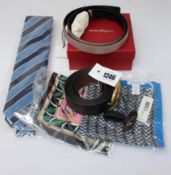 An as new Coach reversible leather belt, a Salvatore Feragammo belt, two Eton pocket squares and