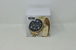 A boxed as new Michael Kors Access Bradshaw 2 (44mm) GPS smart watch in rose gold, compatible with