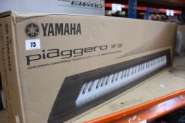 A boxed as new Yamaha Piaggero NP-12B digital keyboard.