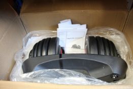 A boxed adjustable dumbbell.
