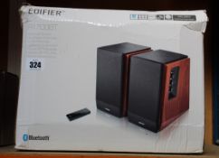 A pair of boxed Edifier R1700BT multimedia speakers.