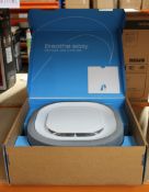 A boxed as new Aura Air rev 1.0 wall mounted air purifier.