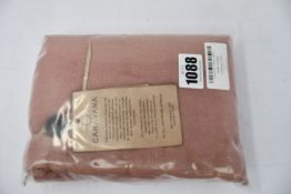 An as new Caravana Lan long vest in carmine red (One size - RRP £288).