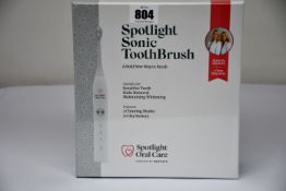 A boxed as new sealed Spotlight Sonic Toothbrush.
