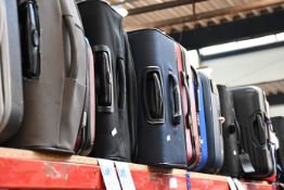 A quantity of empty suitcases and holdalls.