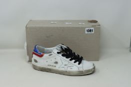 A pair of as new Golden Goose Superstar distressed trainers (EU 40).