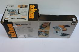 A boxed Triton TTS 185KIT 1400W Track Saw Kit (186mm).