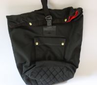 An as new Malle London backpack with dry bag cover.
