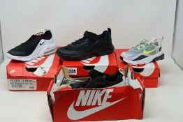 Six pairs of children's /infants as new Nike trainers.