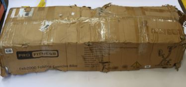 A boxed Pro Fitness roger black gold folding exercise bike (Looks to be as new).