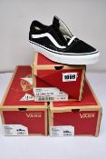 Three pairs of as new Vans Old Skool sneakers in black and white (UK 5.5, 6, 9.5).