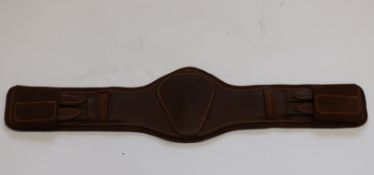 An as new Childeric Sellier short anatomical girth in brown (Girth size: 65cm).