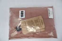 An as new Caravana Lan long vest in carmine red (One size - RRP £288).