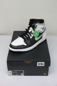A pair of as new Nike Air Jordan 1 Mid (UK 6).