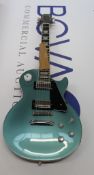 A Boxed as new Epiphone Les Paul modern faded pelham blue electric guitar.