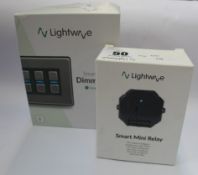A boxed pre-owned Lightwave smart dimmer L-24 4-Gang (5060252202688) and a boxed pre-owned Lightwave