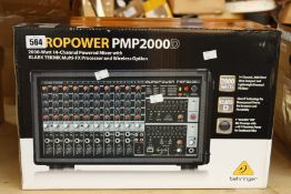 A boxed as new Behringer Europower PMP2000D 2000 watt 14 channel powered mixer.